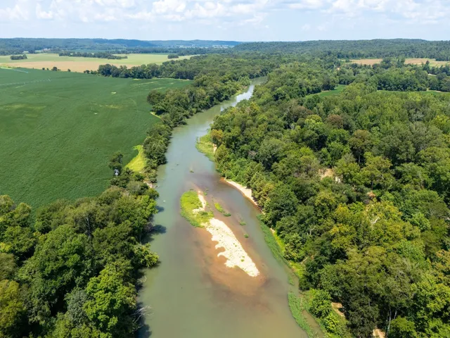 a view of a lake with a yard