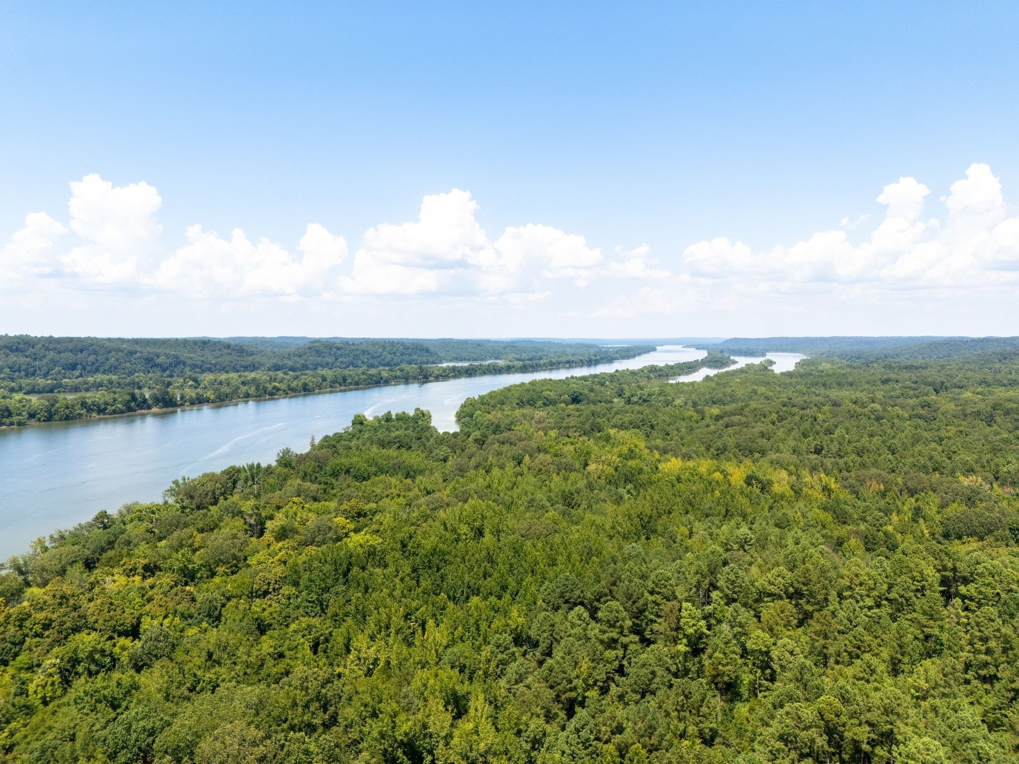 655 Dyer Road Hurricane Mills, TN 37078 - Photo 19 of 36 a view of a lake with houses in back