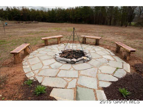 3624 Rockfish Road Grottoes, VA 24441 - Photo 21 of 26 a view of a backyard with table and chairs