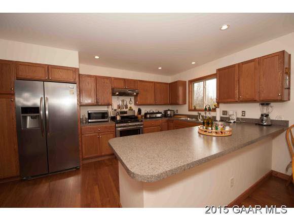 3624 Rockfish Road Grottoes, VA 24441 - Photo 3 of 26 a kitchen with stainless steel appliances granite countertop a sink refrigerator and microwave