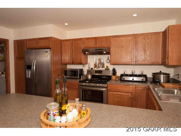 3624 Rockfish Road Grottoes, VA 24441 - Photo 7 of 26 a kitchen with stainless steel appliances granite countertop a sink stove and refrigerator