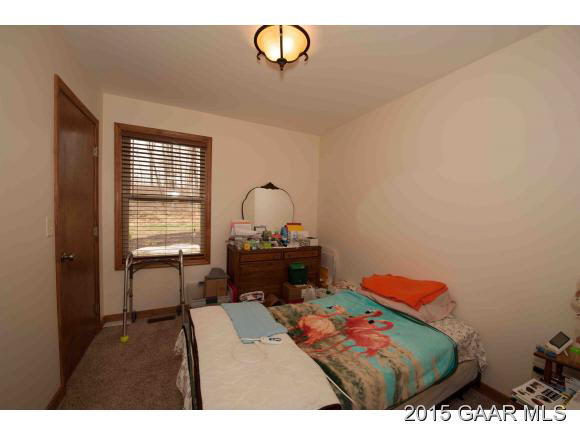3624 Rockfish Road Grottoes, VA 24441 - Photo 9 of 26 a bedroom with a bed and a dresser