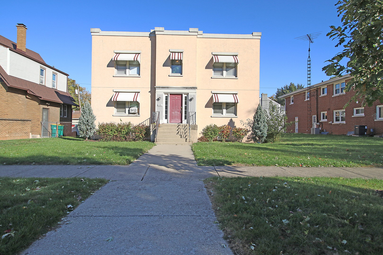a view of a building with a yard