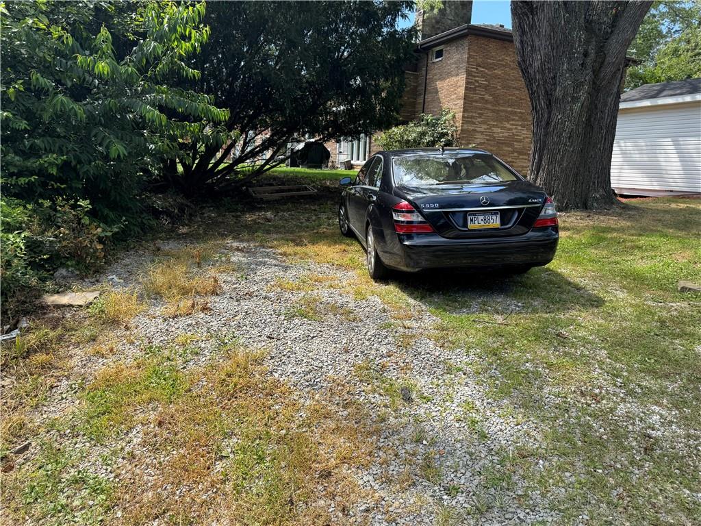 815 Braddock Road Pittsburgh, PA 15221 - Photo 31 of 31 a car parked in front of a house