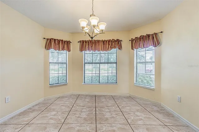 a bedroom with bed and a potted plant