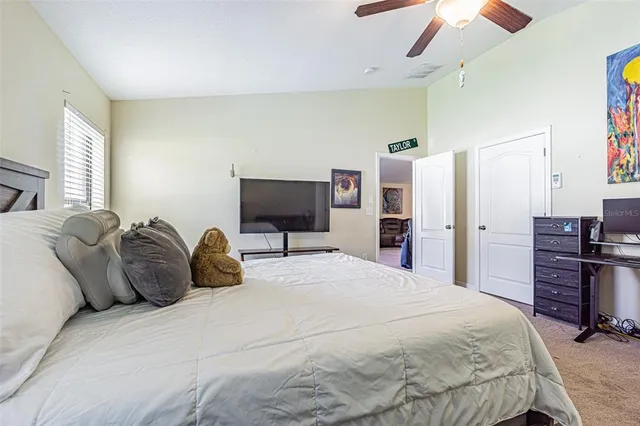 a view of a street with house in the background