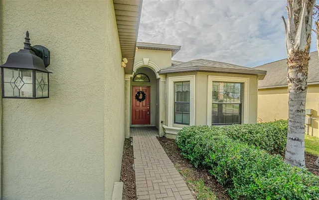 a kitchen with kitchen island granite countertop a sink and cabinets