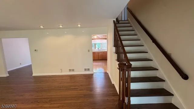 a view of entryway with wooden floor