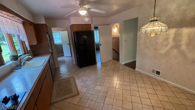a view of a livingroom with furniture and a chandelier