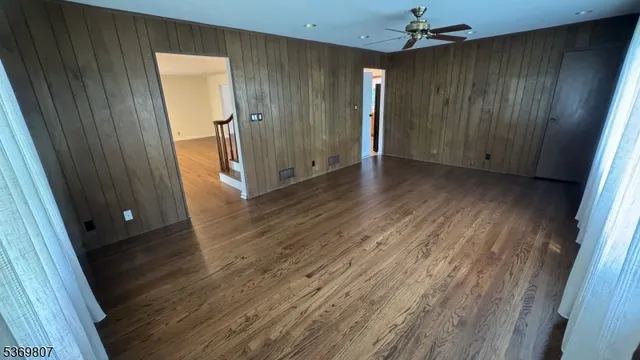 a view of hallway with wooden floor
