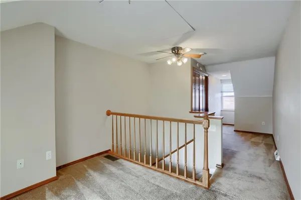 a view of a workspace with furniture and a potted plant