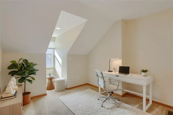 a view of an empty room with windows