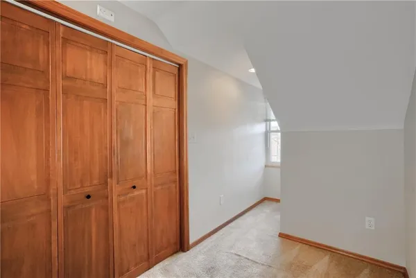 a view of an empty room with stairs