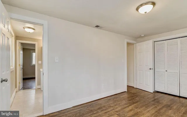 a bathroom with a sink a toilet a mirror and vanity