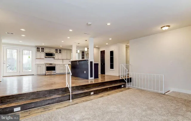 a kitchen with stainless steel appliances granite countertop a sink and stove top oven