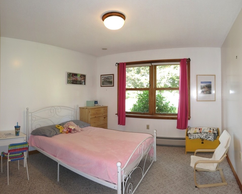 266 Hadley Road Sunderland, MA 01375 - Photo 13 of 23 a bed room with a bed and a chair