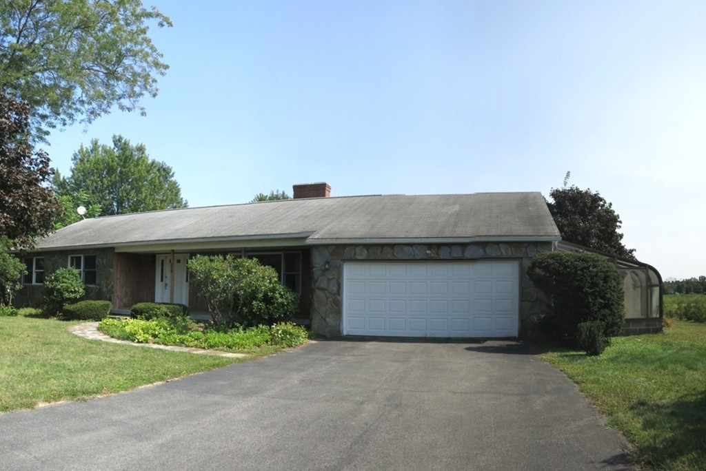 266 Hadley Road Sunderland, MA 01375 - Photo 23 of 23 a front view of house with yard and trees
