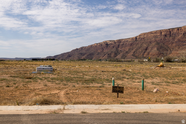 212 Lidia Circle, Unit 17 Moab, UT 84532 - Photo 11 of 24 Expansive undeveloped lot featuring natural desert landscaping and a distant mountain backdrop