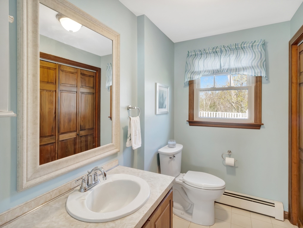 15 Riverside Drive Mansfield, MA 02048 - Photo 12 of 42 a bathroom with a sink and a mirror