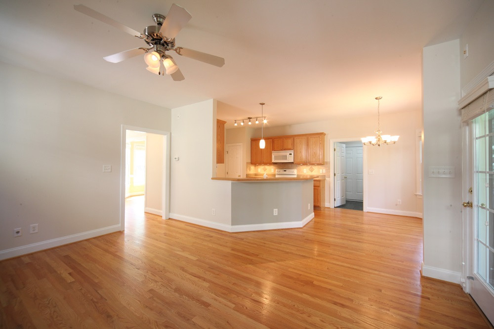 104 Rushing Wind Way Apex, NC 27502 - Photo 7 of 25 Family Room Opens to Kitchen