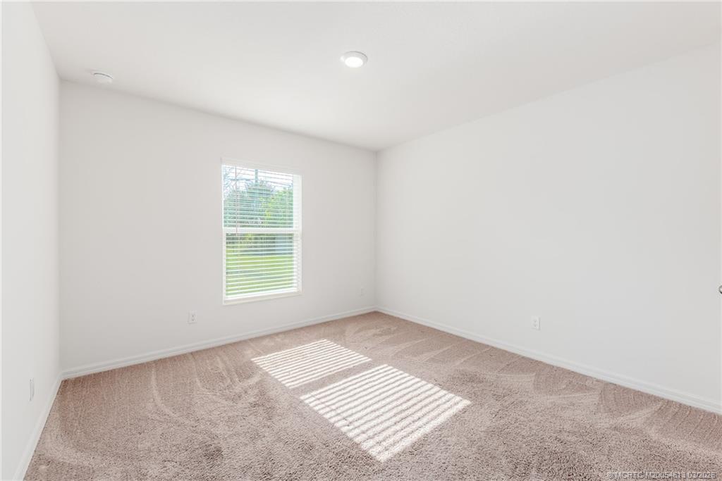2108 Southwest Vista Road Port St. Lucie, FL 34953 - Photo 14 of 19 an empty room with a window