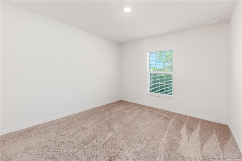 2108 Southwest Vista Road Port St. Lucie, FL 34953 - Photo 15 of 19 an empty room with a window