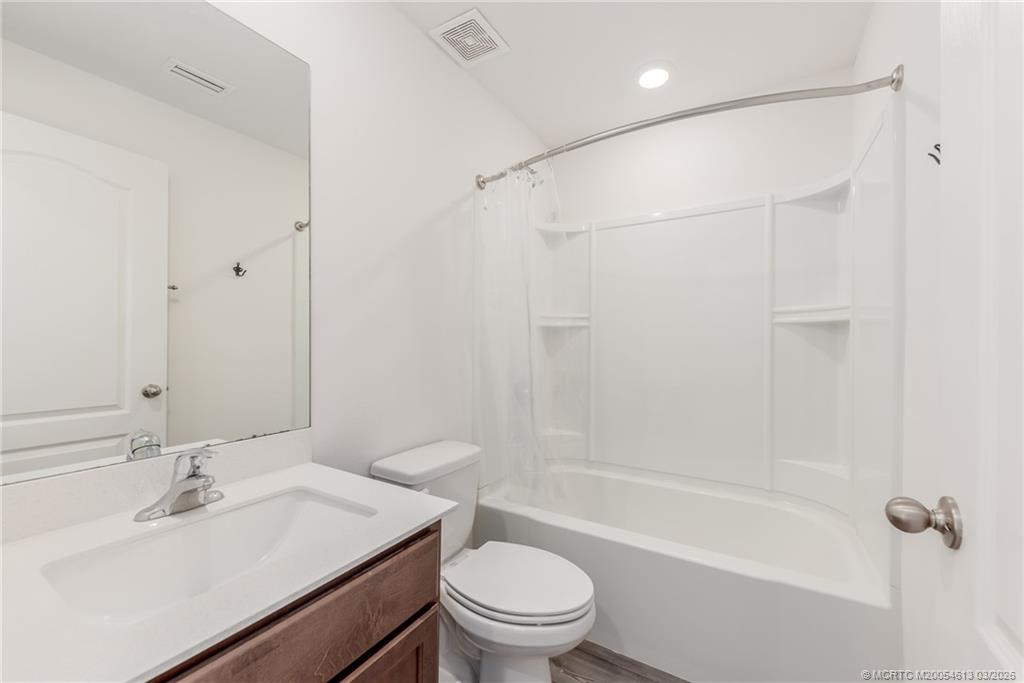 2108 Southwest Vista Road Port St. Lucie, FL 34953 - Photo 16 of 19 a bathroom with a sink toilet and shower