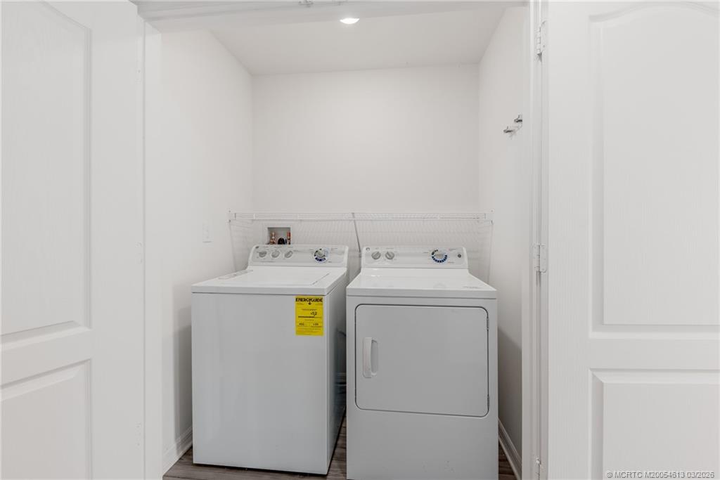 2108 Southwest Vista Road Port St. Lucie, FL 34953 - Photo 17 of 19 a utility room with dryer and washer