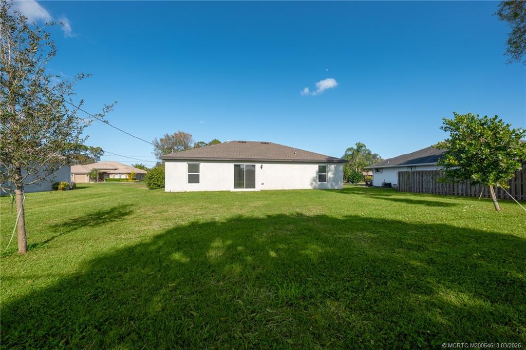 2108 Southwest Vista Road Port St. Lucie, FL 34953 - Photo 19 of 19 a front view of a house with garden