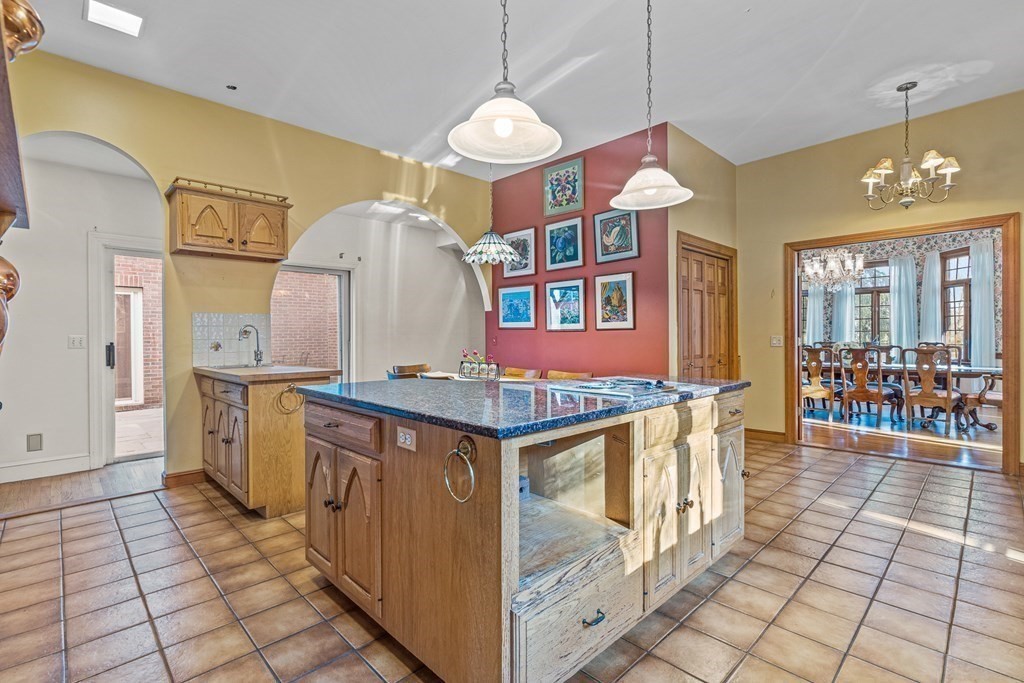 3 Myopia Road Winchester, MA 01890 - Photo 11 of 39 a kitchen with stainless steel appliances granite countertop a stove a sink and a refrigerator