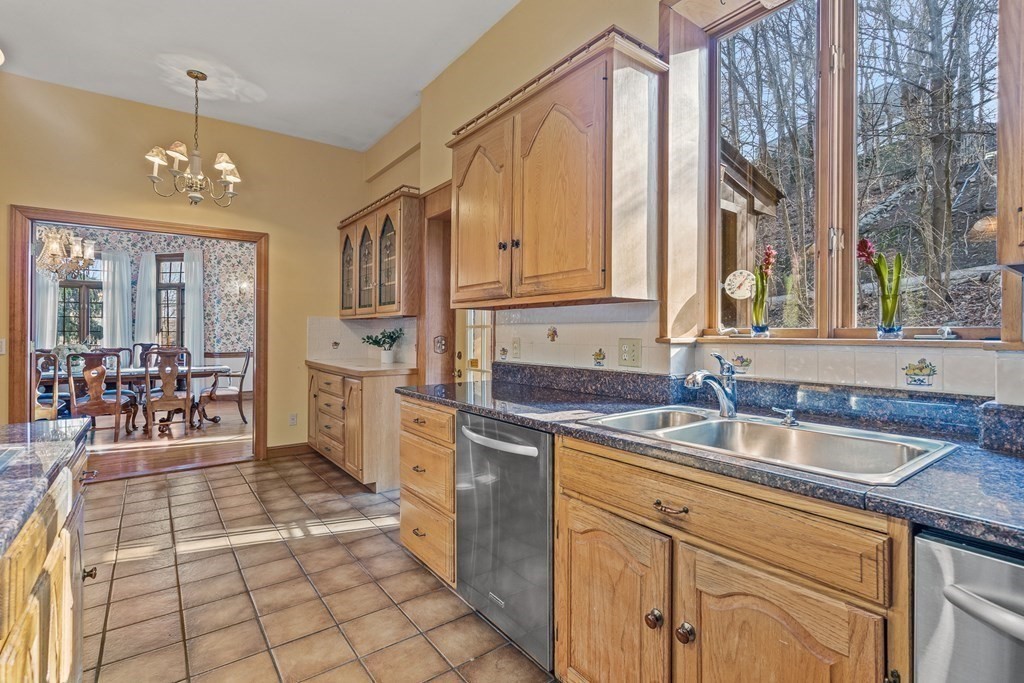 3 Myopia Road Winchester, MA 01890 - Photo 12 of 39 a kitchen with stainless steel appliances granite countertop a sink and cabinets