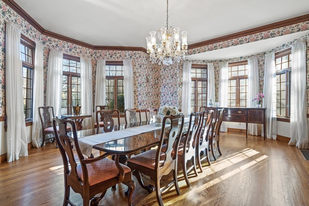 3 Myopia Road Winchester, MA 01890 - Photo 19 of 39 a view of a dining room with furniture a chandelier and wooden floor