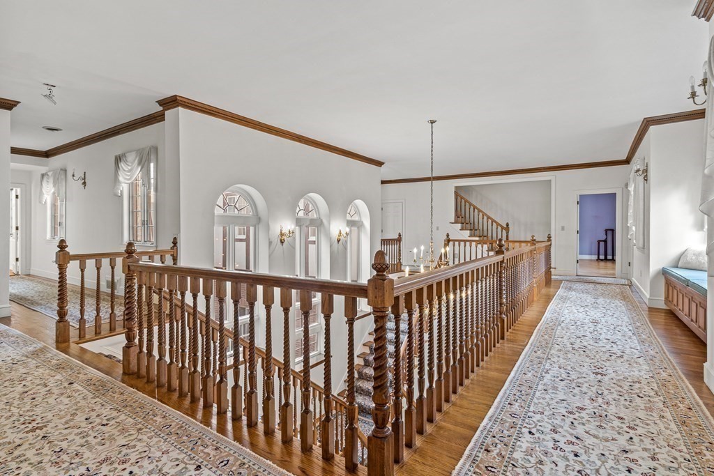 3 Myopia Road Winchester, MA 01890 - Photo 21 of 39 a view of a hallway with wooden floor and stairs