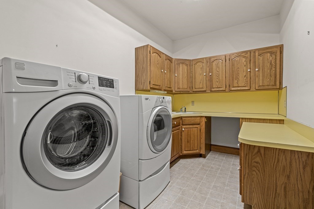 3 Myopia Road Winchester, MA 01890 - Photo 28 of 39 a utility room with sink dryer and washer