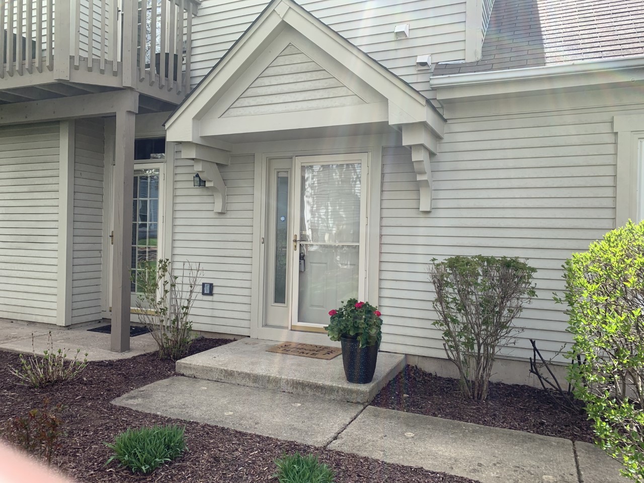 910 Prospect Court, Unit 910 Naperville, IL 60540 - Photo 1 of 17 a front view of a house with garden
