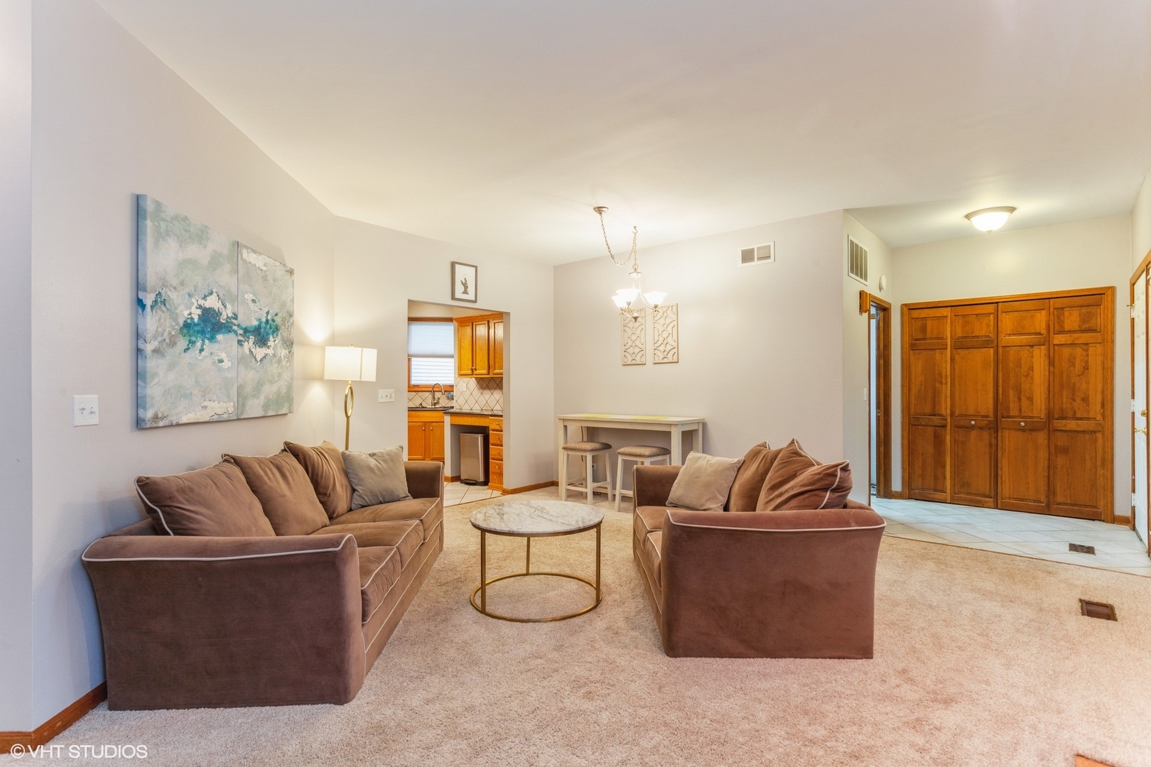 910 Prospect Court, Unit 910 Naperville, IL 60540 - Photo 13 of 17 a living room with furniture and a large window