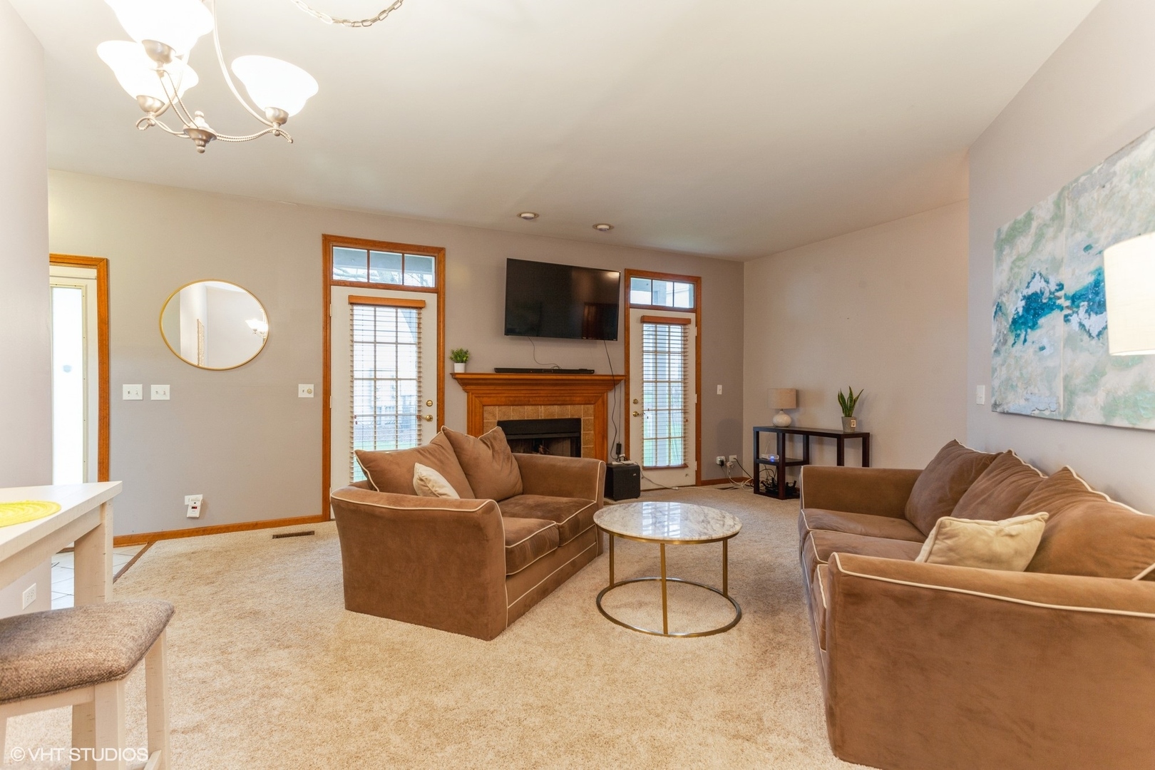 910 Prospect Court, Unit 910 Naperville, IL 60540 - Photo 3 of 17 a living room with furniture a fireplace and a flat screen tv