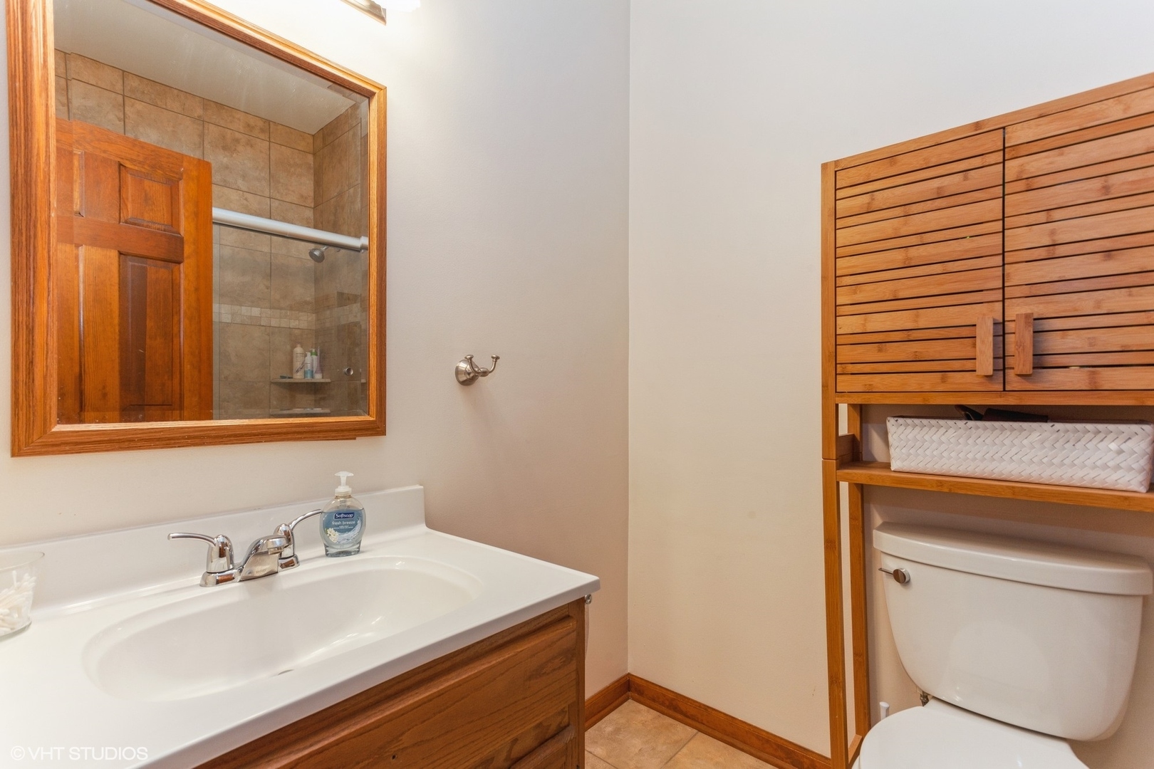 910 Prospect Court, Unit 910 Naperville, IL 60540 - Photo 7 of 17 a bathroom with a sink and a mirror