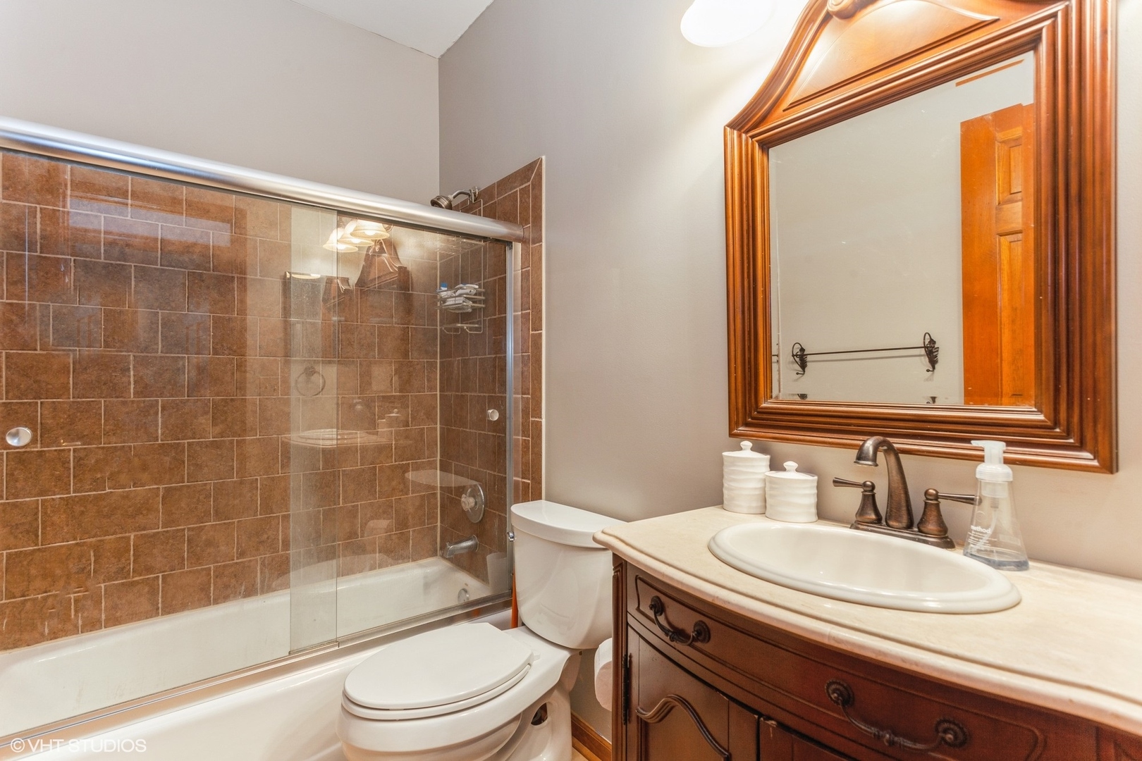 910 Prospect Court, Unit 910 Naperville, IL 60540 - Photo 8 of 17 a bathroom with a sink a toilet and shower