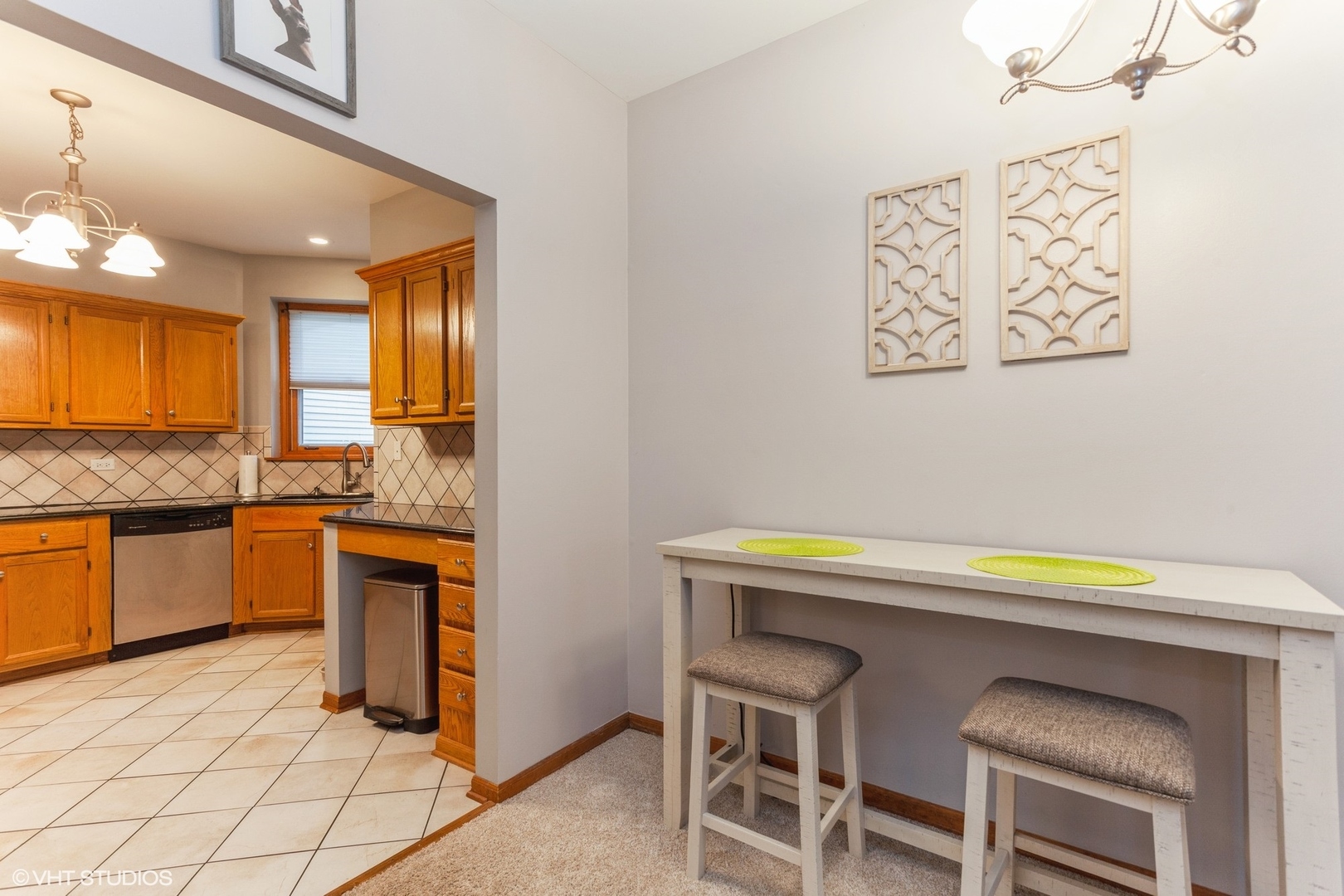 910 Prospect Court, Unit 910 Naperville, IL 60540 - Photo 9 of 17 a kitchen with a sink cabinets and counter space