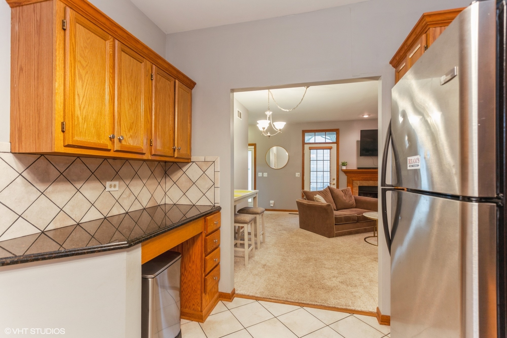 910 Prospect Court, Unit 910 Naperville, IL 60540 - Photo 10 of 17 a kitchen with stainless steel appliances granite countertop a refrigerator a stove a sink and dishwasher