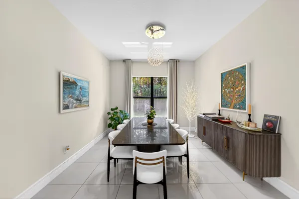 a large kitchen with stainless steel appliances and a refrigerator