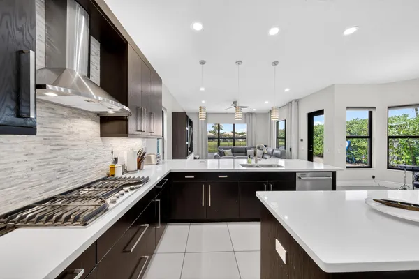 a large kitchen with a table and chairs