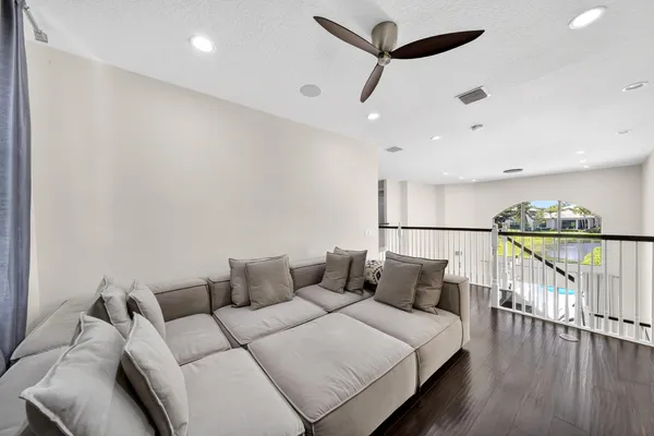 a living room with a couch and a large window