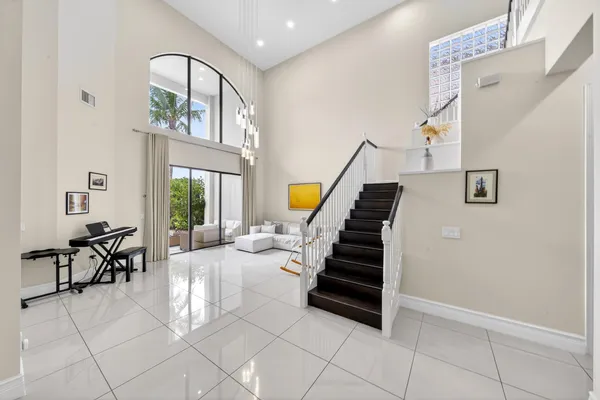 a view of entryway and hall with dining room