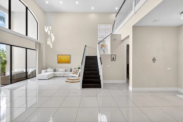 a view of entryway and hall with a couch