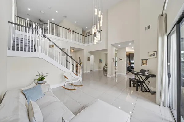 a large kitchen with stainless steel appliances lots of counter space and a sink