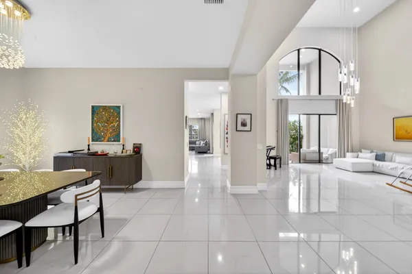 a kitchen with kitchen island stainless steel appliances a sink stove and refrigerator