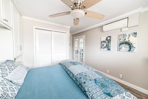 a bedroom with bed and window