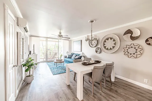 a view of a dining room with furniture window and wooden floor